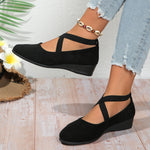 Women’s pointed toe cross-strap wedge flats in black suede with elastic band at ankle