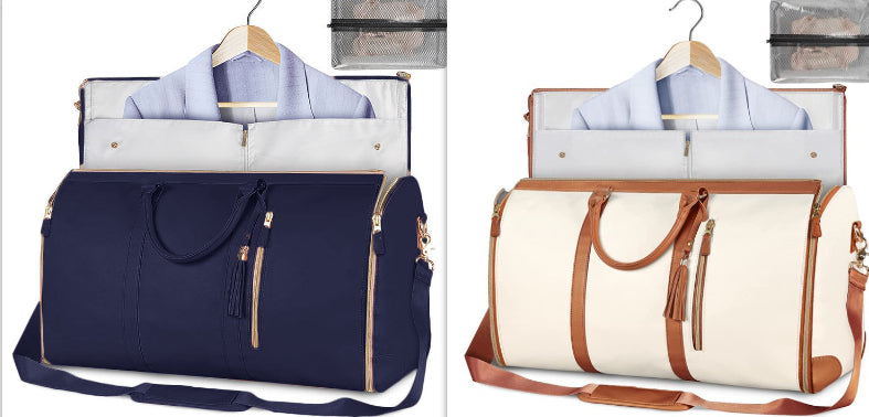 Duffle bags on hangers: navy and cream with tan shoulder straps and tassel zipper pulls
