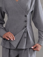 Light gray asymmetrical button front top detail with long sleeves