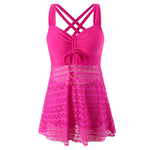 Hot pink one-piece swimsuit with crisscross back straps and lace overlay skirt