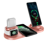 Wireless charging dock station with pink base and phone, smartwatch, and earbuds dock