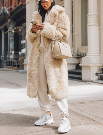 Long faux fur coat in beige plush with open front and long sleeves