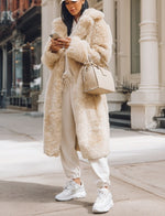Long faux fur coat in beige plush with roomy oversized fit and open front