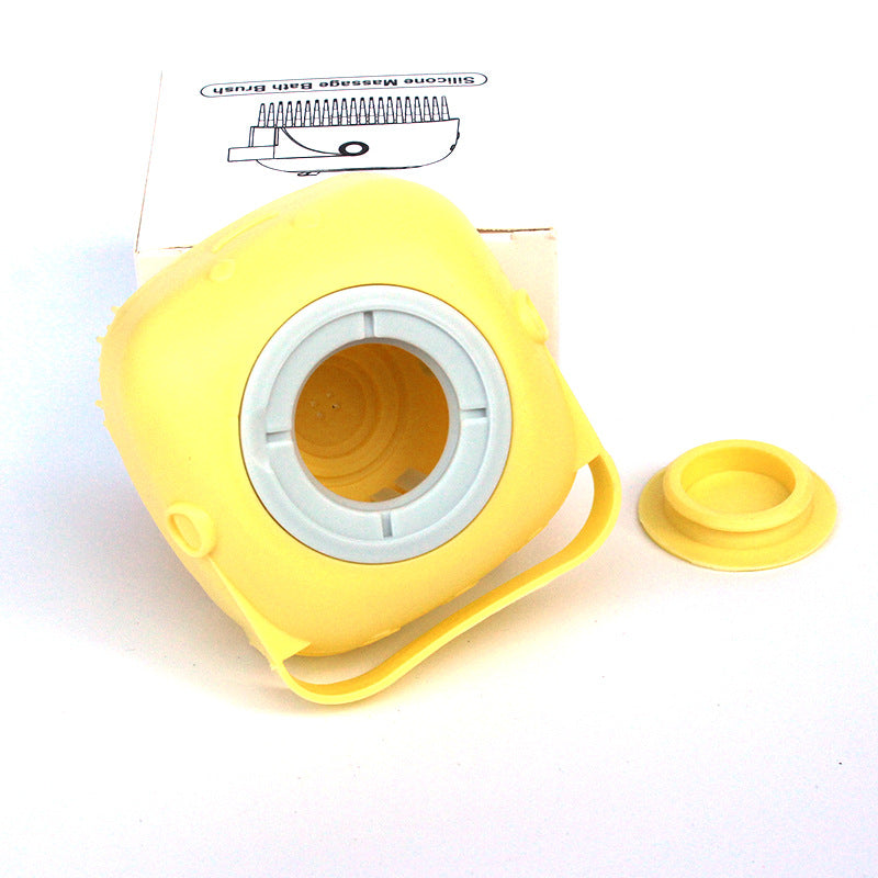 Yellow silicone bath massage brush head with open center cup and snap-on lid