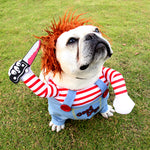 Dog Halloween costume close-up: orange wig, striped arms, light-blue overalls with Good Dogs patch