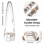 White crossbody bag with adjustable floral embroidered strap and metal buckle closure
