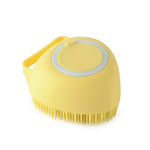 Yellow silicone pet bath massage brush with circular pad and short rubber bristles