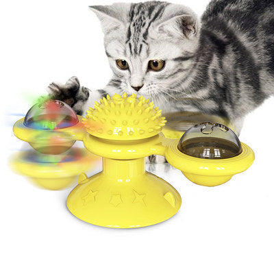 Cat rotating windmill toy with yellow base, spiky topper, and side spinning cups