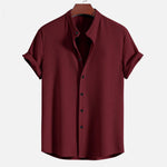 Wine red short sleeve button-up shirt with pointed collar and vertical textured fabric