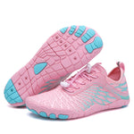 Pink water shoes with aqua accents, lace-up mesh upper, and grippy tread sole.