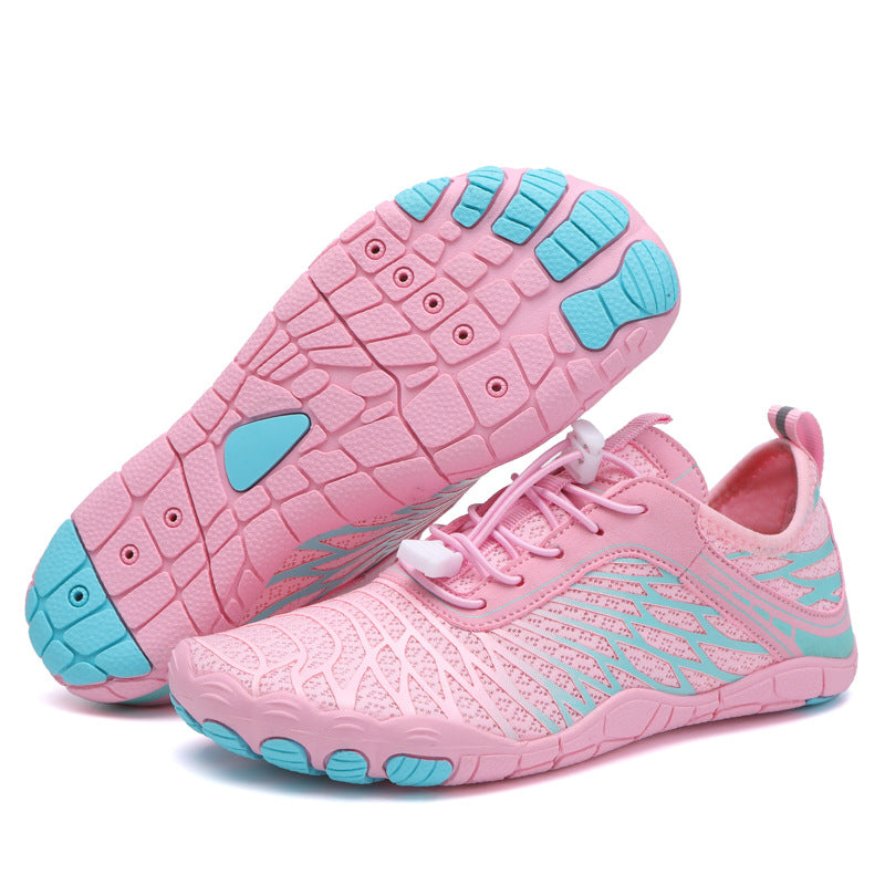 Pink water shoes with aqua accents, lace-up mesh upper, and grippy tread sole.