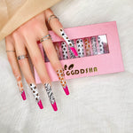 Stiletto press-on nails with zebra and leopard print and gold-toned studs