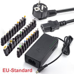 Universal power adapter with EU-style plug, multiple DC tips, and LED indicator lights