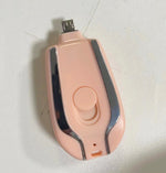 Pink keychain power pod charger, side view with charging port and round front button
