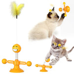 Orange windmill cat toy with spring ball attachments and a yellow fuzzy feather
