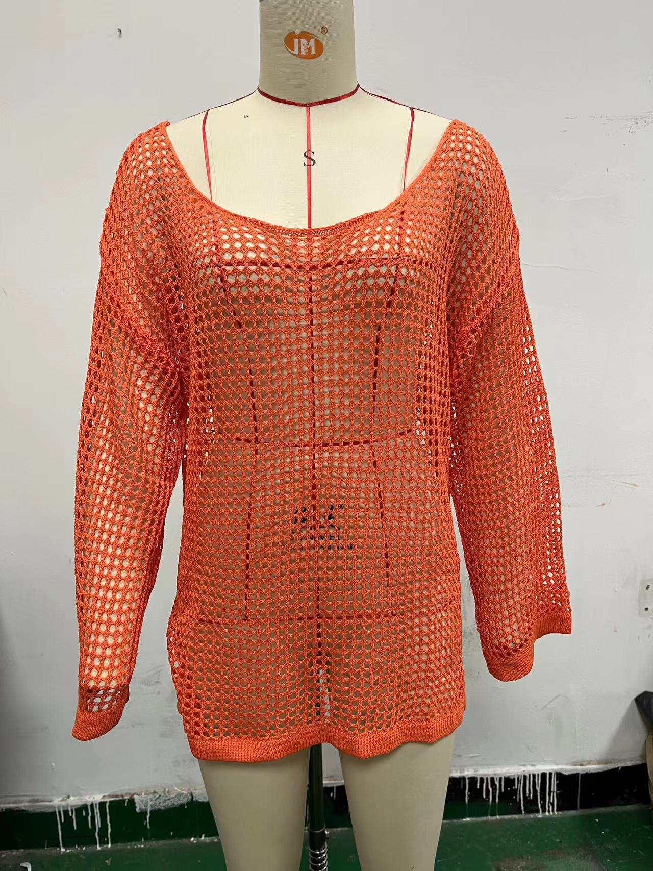 Orange mesh hollow-knit beach cover-up top with long sleeves and wide neckline
