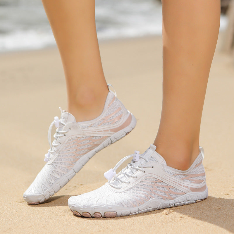 White unisex water shoes with lace-up closure and textured rubber outsole