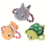 Set of turtle-shaped dog chew toys in gray, orange, and green plush