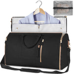 Black waterproof duffle bag open with garment storage panel and zipper pockets