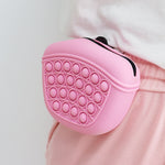 Pink silicone dog treat pouch with pop-bubble front, for waist training rewards