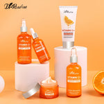 Vitamin C+ skincare bottles and tubes with face cream jar and cleanser tube