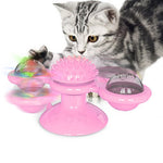 Pink windmill cat toy with clear side spheres and fuzzy texture top