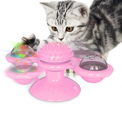 Pink windmill cat toy with clear side spheres and fuzzy texture top