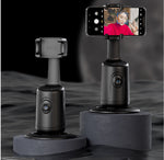 Auto tracking smartphone gimbal with mounted phone on a black stand base