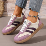 Women's casual sneakers with white upper and purple panels, lace-up, gum outsole