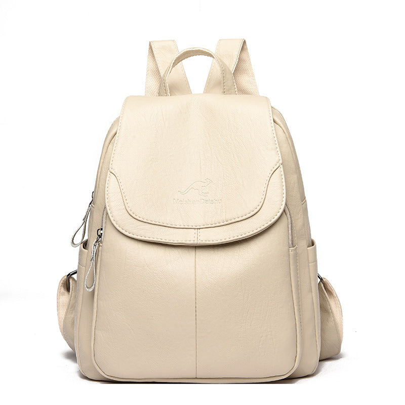 Women's PU leather travel backpack with front flap and side zippers, beige