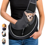 Dark gray pet crossbody bag with mesh strap and front bubble opening, holding a small dog