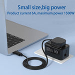 Universal travel adapter with built-in USB ports and connected charging cable