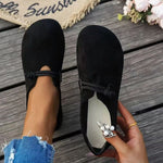 Black suede round-toe flat lace-up shoes with pearl-embellished side detail