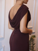 Sleeveless maxi dress with deep cowl neckline and gathered fabric at the tie waist