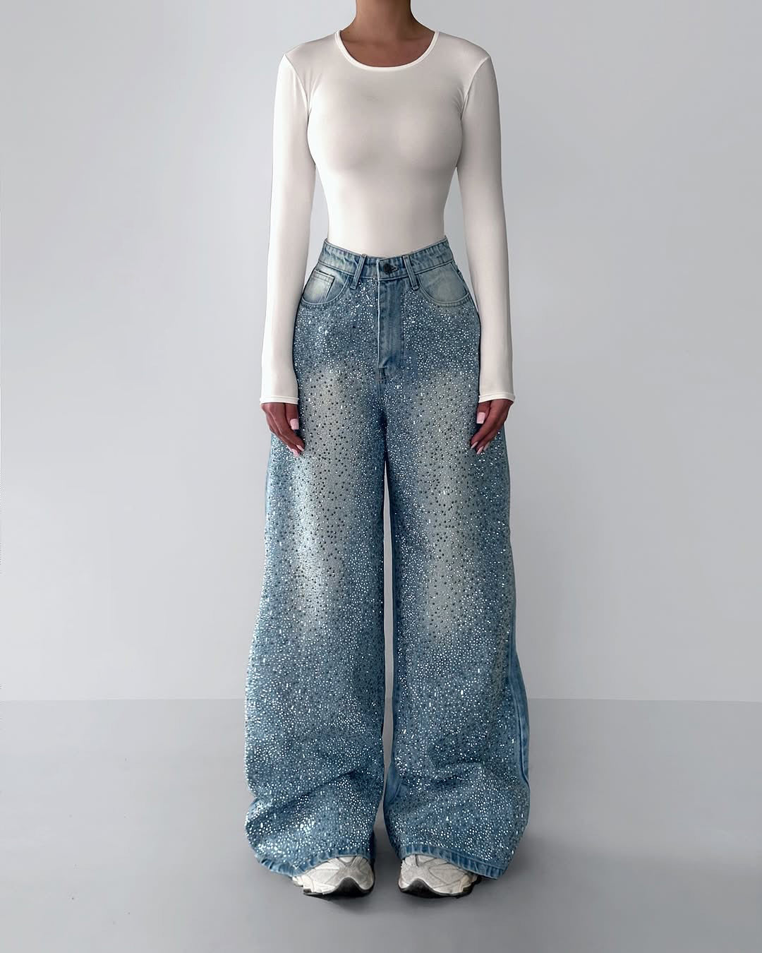 Light blue rhinestone denim jeans with wide leg, full-length, button fly detail