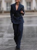 Navy pinstripe blazer and high-waist wide-leg pants with black belt, front view