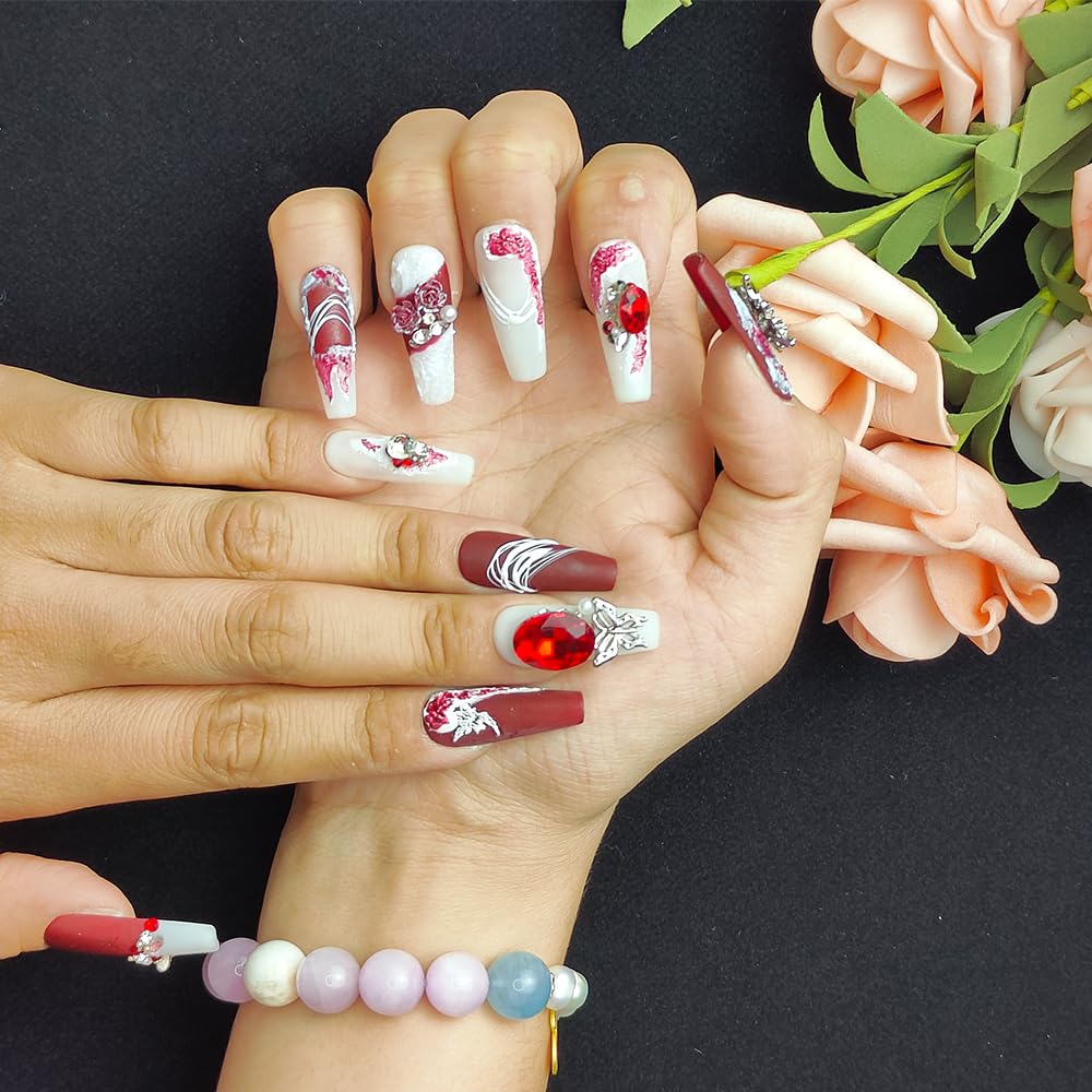 Long press-on nails on hands, red and white with 3D floral art and red rhinestone