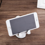 Astronaut resin phone stand with white base and two phone support clips