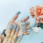 Iridescent crystal rhinestone medium square nails on one hand