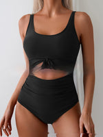 Black one-piece swimsuit with tie-front waist and sheer-look cutout midsection