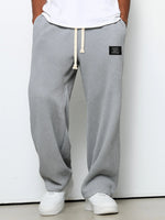 Waffle loose drawstring trousers in gray with straight, relaxed leg silhouette