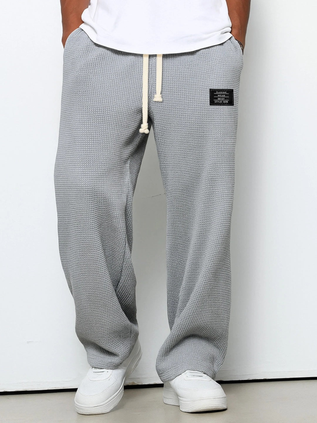 Waffle loose drawstring trousers in gray with straight, relaxed leg silhouette