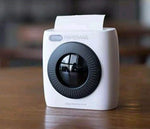 White mini thermal photo printer with front lens window, top paper feed open
