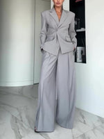 Light gray blazer and wide-leg pants suit with notch lapels, full-length view