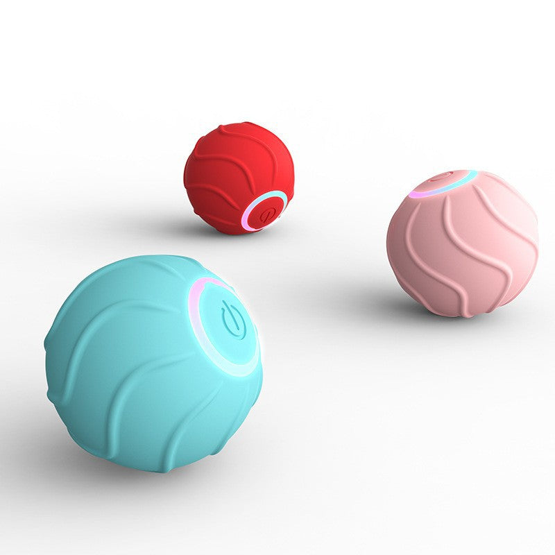 Interactive cat rolling balls in teal, pink, and red with glowing icons