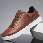 Brown lace-up casual shoes with round toe, brown laces, and white textured sole
