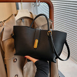 Dark brown textured PU bucket tote bag with front zipper and adjustable strap.