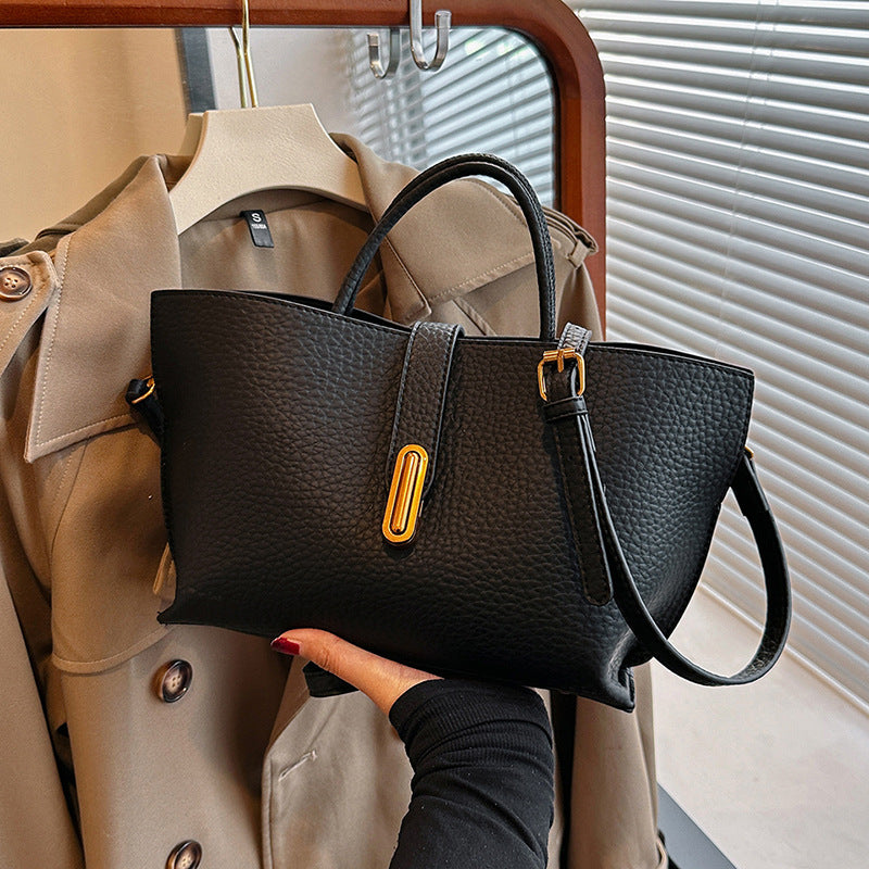 Dark brown textured PU bucket tote bag with front zipper and adjustable strap.
