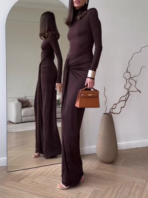 Dark brown long-sleeve maxi dress with draped waist and side slit, slim fit