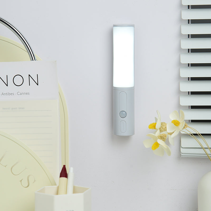 Wall-mounted LED night light with glowing rectangular lamp and gray body